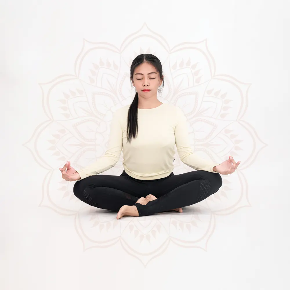 Cookie seated in lotus pose, eyes closed